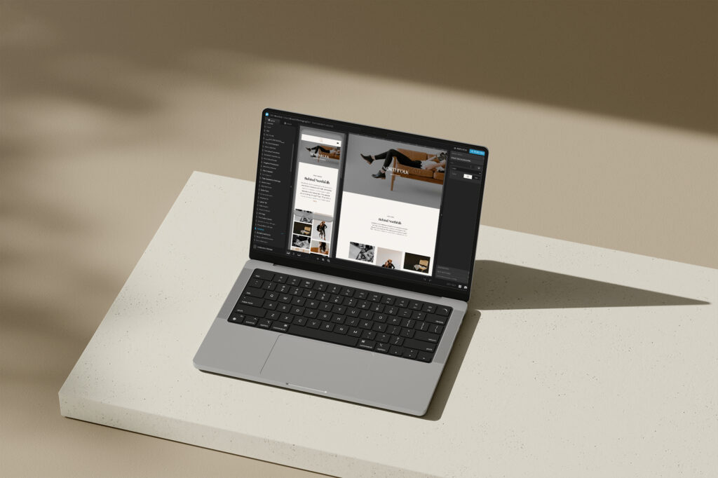 A laptop sitting on the ground showcasing a Northfolk design on Showit.